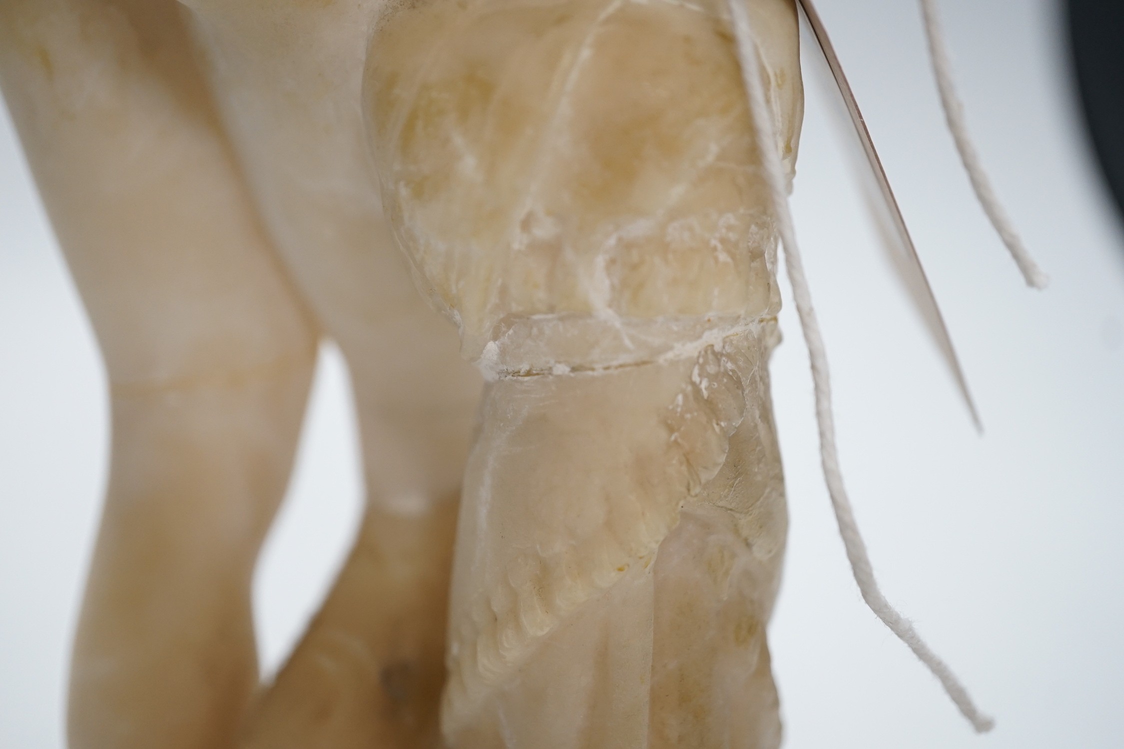 A carved alabaster female classical figure, the Greek slave Hiram Powers, 36cms high